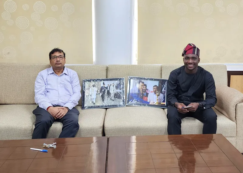 With the Dean in his office · Oluwaferanmi Iyiola